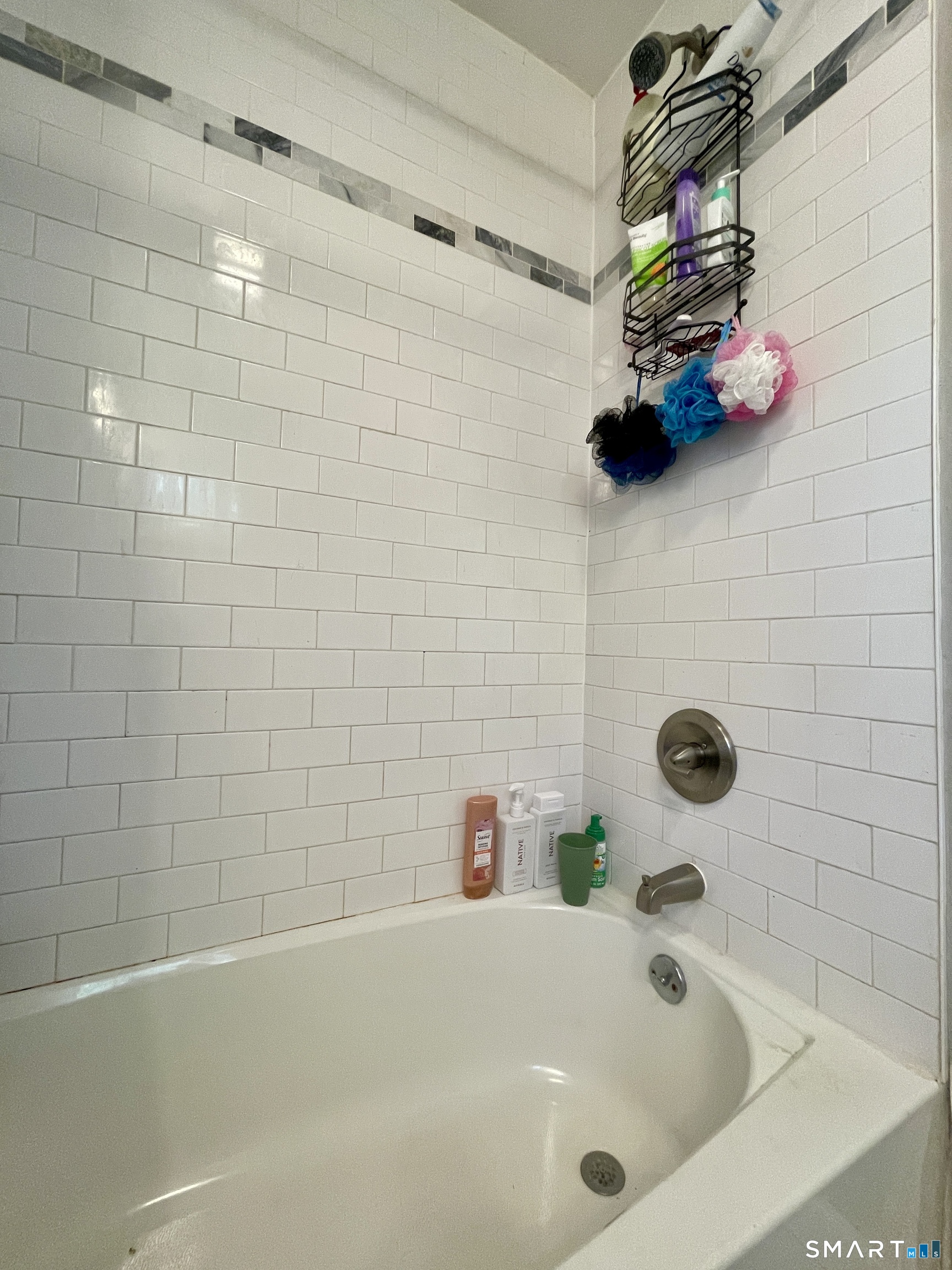 16 Brainard Road Enfield, CT 06082 - Photo 14 of 32 a bathroom with a tub sink and mirror