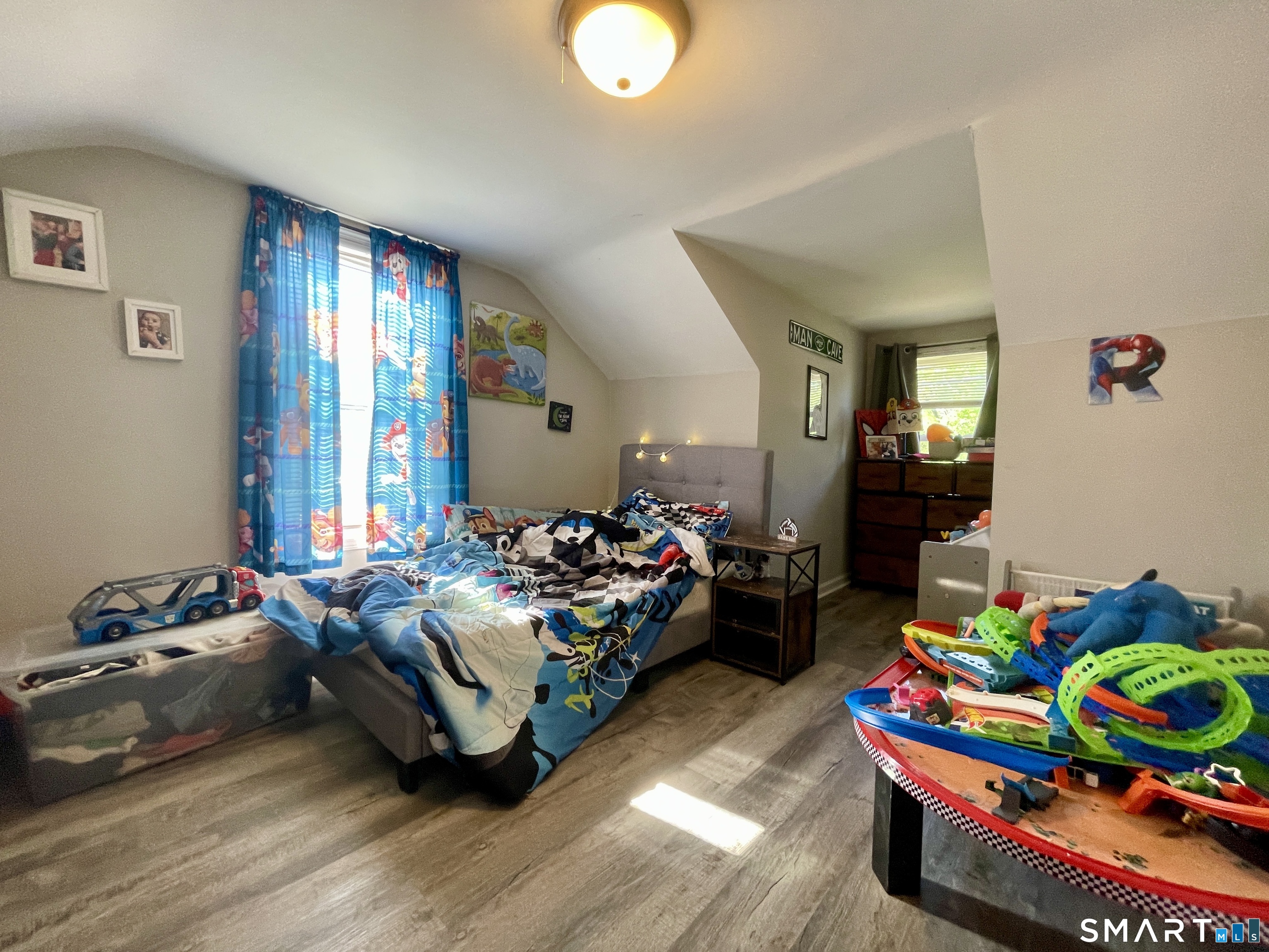 16 Brainard Road Enfield, CT 06082 - Photo 23 of 32 a bedroom with furniture and a wooden floor