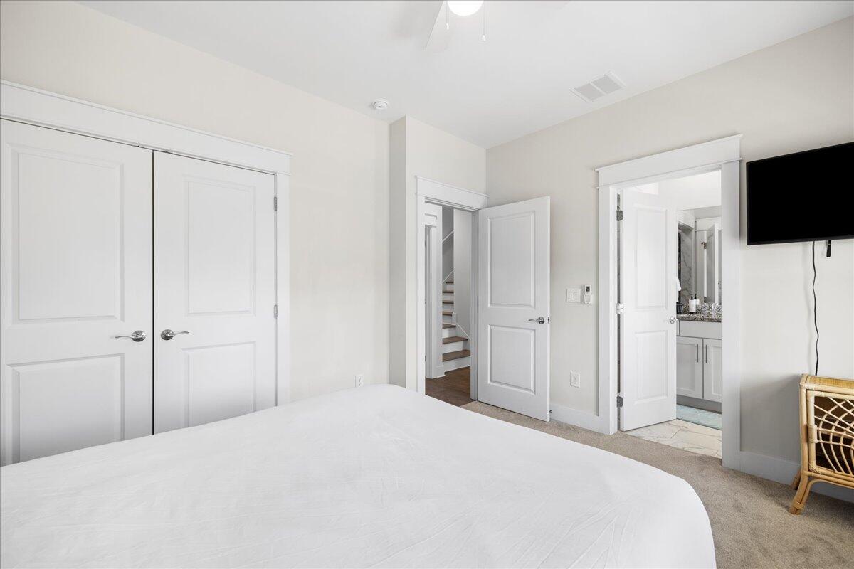 16 Valerie Way Inlet Beach Inlet Beach, FL 32461 - Photo 14 of 35 a bedroom with a bed and a flat screen tv