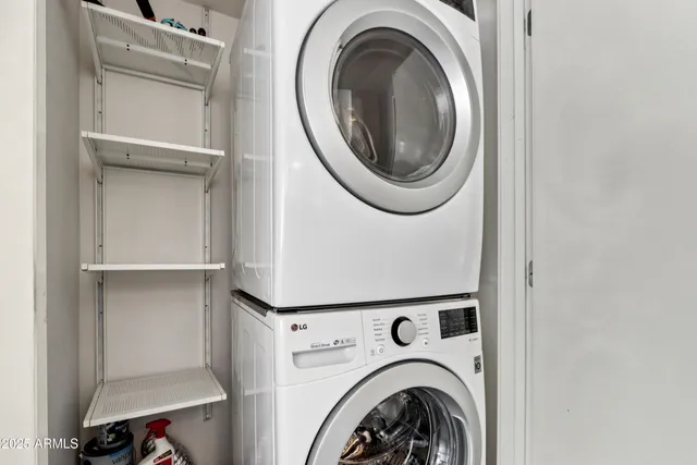 a view of kitchen with microwave and refrigerator
