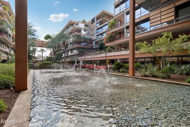 an outdoor space with lots of swings and slides