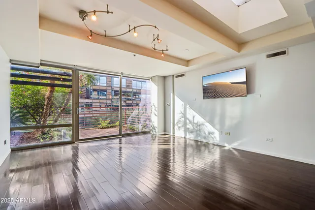 a kitchen with granite countertop a stove top oven microwave and cabinets