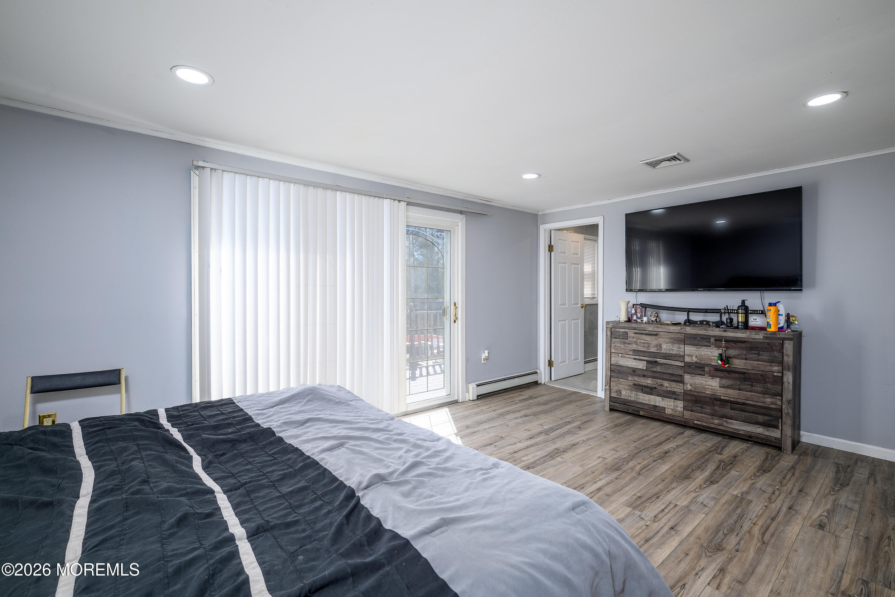 570 Eltone Road Jackson, NJ 08527 - Photo 20 of 37 a bedroom with furniture and flat screen tv