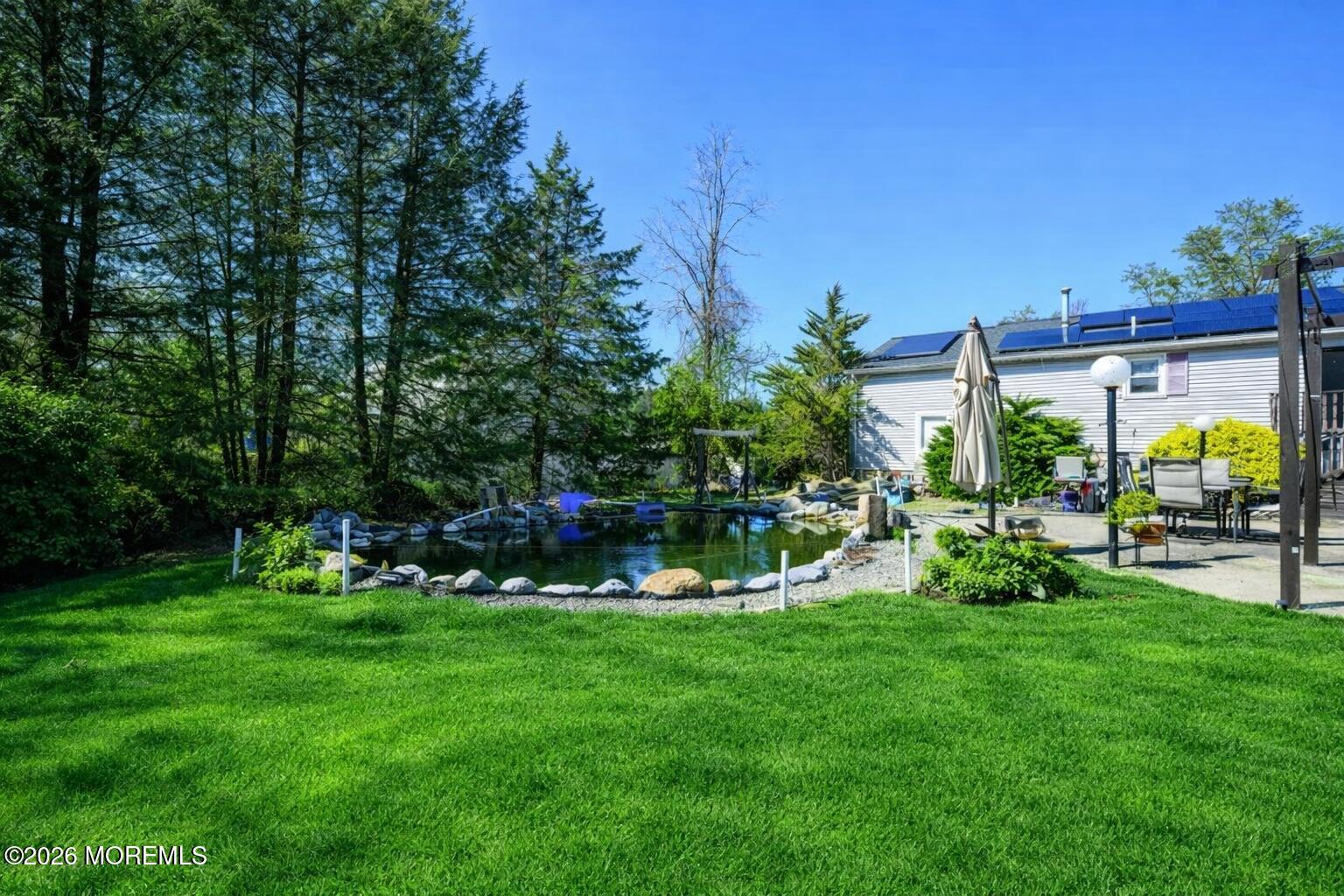 570 Eltone Road Jackson, NJ 08527 - Photo 34 of 37 a view of yard with swimming pool and green space