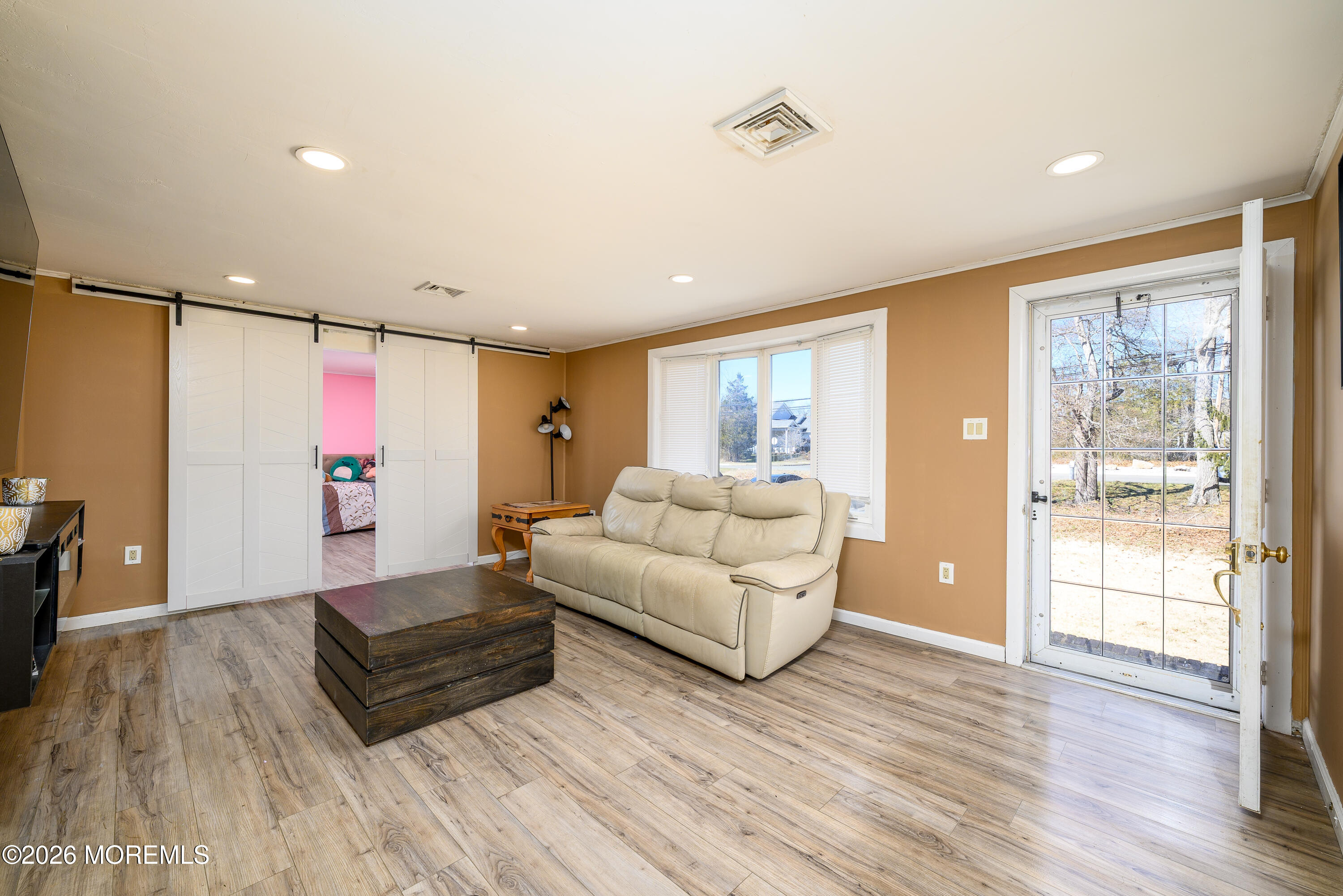 570 Eltone Road Jackson, NJ 08527 - Photo 9 of 37 a living room with furniture and a wooden floor