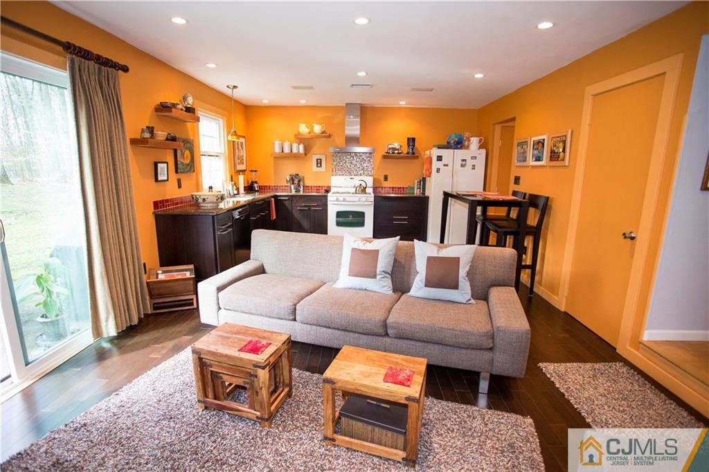 1301 Timber Oaks Road, Unit 1301 Edison, NJ 08820 - Photo 13 of 25 a living room with furniture and a rug