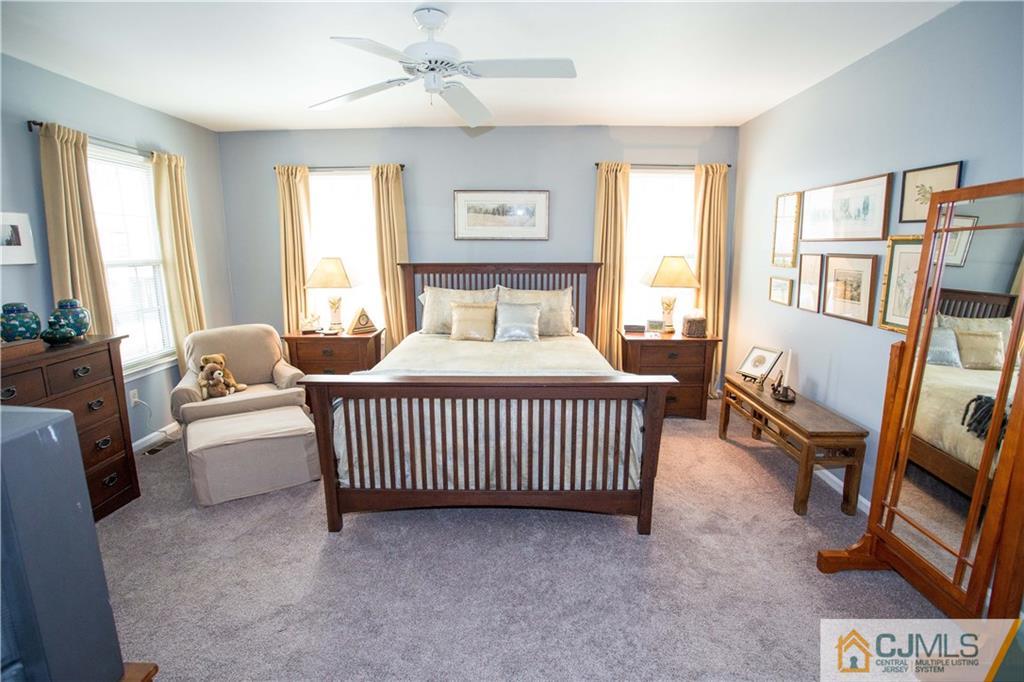 1301 Timber Oaks Road, Unit 1301 Edison, NJ 08820 - Photo 18 of 25 a bedroom with a bed and a couch