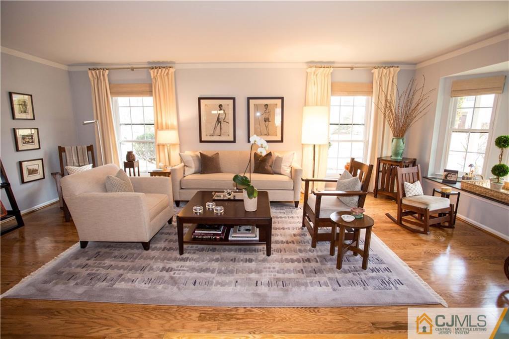 1301 Timber Oaks Road, Unit 1301 Edison, NJ 08820 - Photo 3 of 25 a living room with furniture wooden floor and a large window