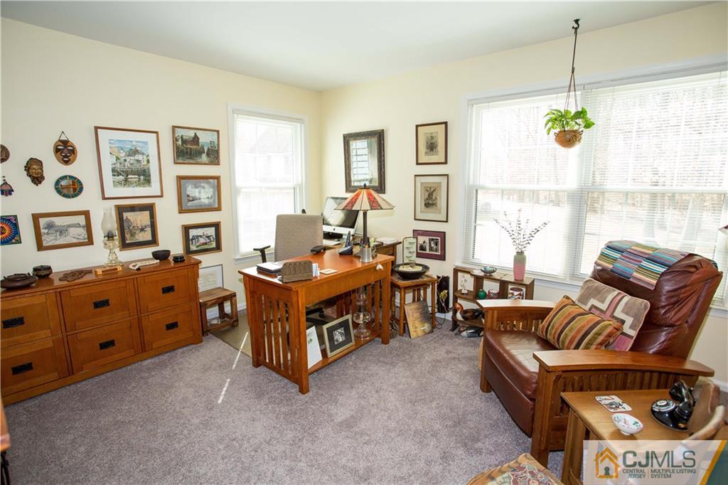 1301 Timber Oaks Road, Unit 1301 Edison, NJ 08820 - Photo 21 of 25 a living room with furniture and a window