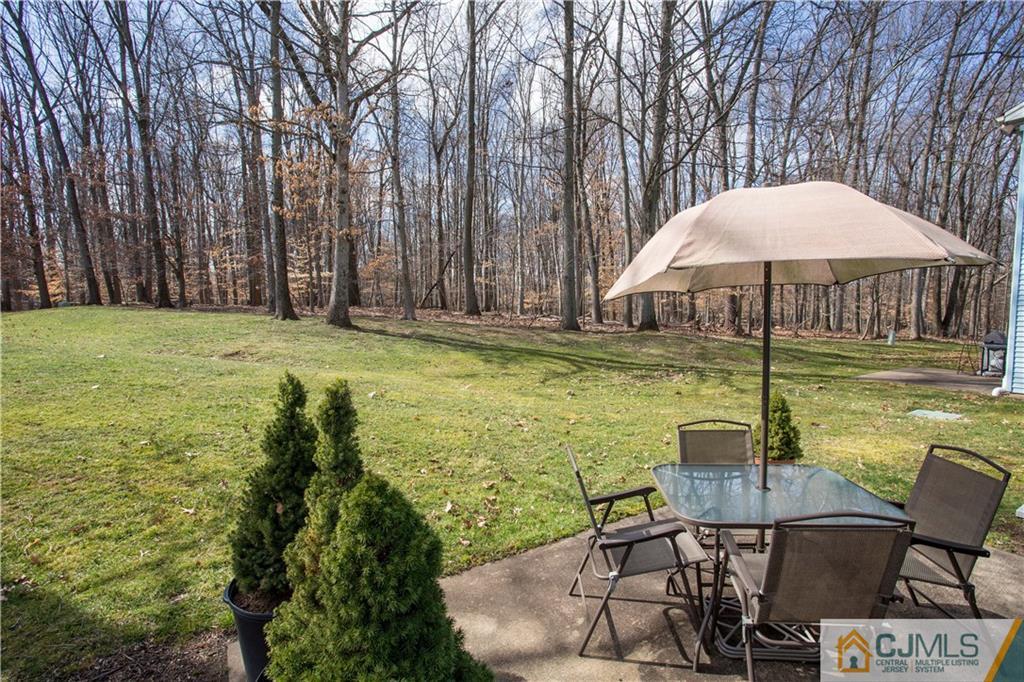 1301 Timber Oaks Road, Unit 1301 Edison, NJ 08820 - Photo 24 of 25 a swimming pool with outdoor seating and yard