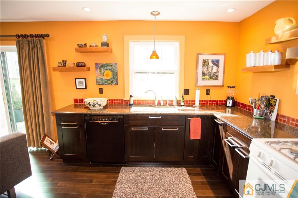 1301 Timber Oaks Road, Unit 1301 Edison, NJ 08820 - Photo 5 of 25 a kitchen with a sink cabinets and wooden floor