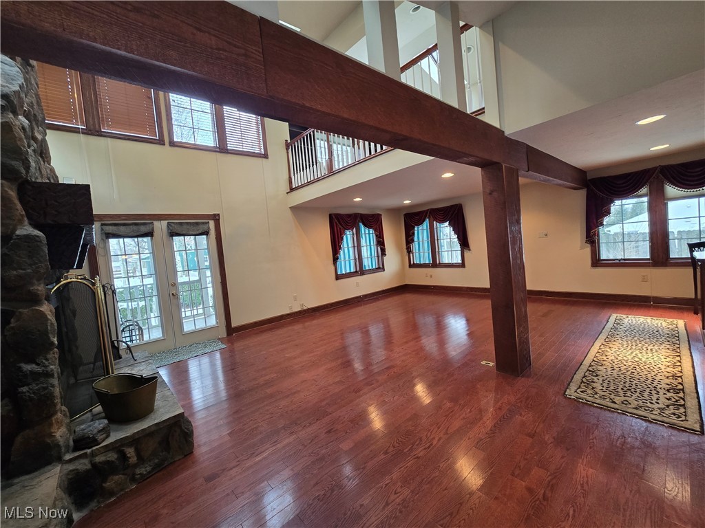 4300 Poe Road Medina, OH 44256 - Photo 8 of 45 Great room with beams vaulted ceilings and hardwood flooring
