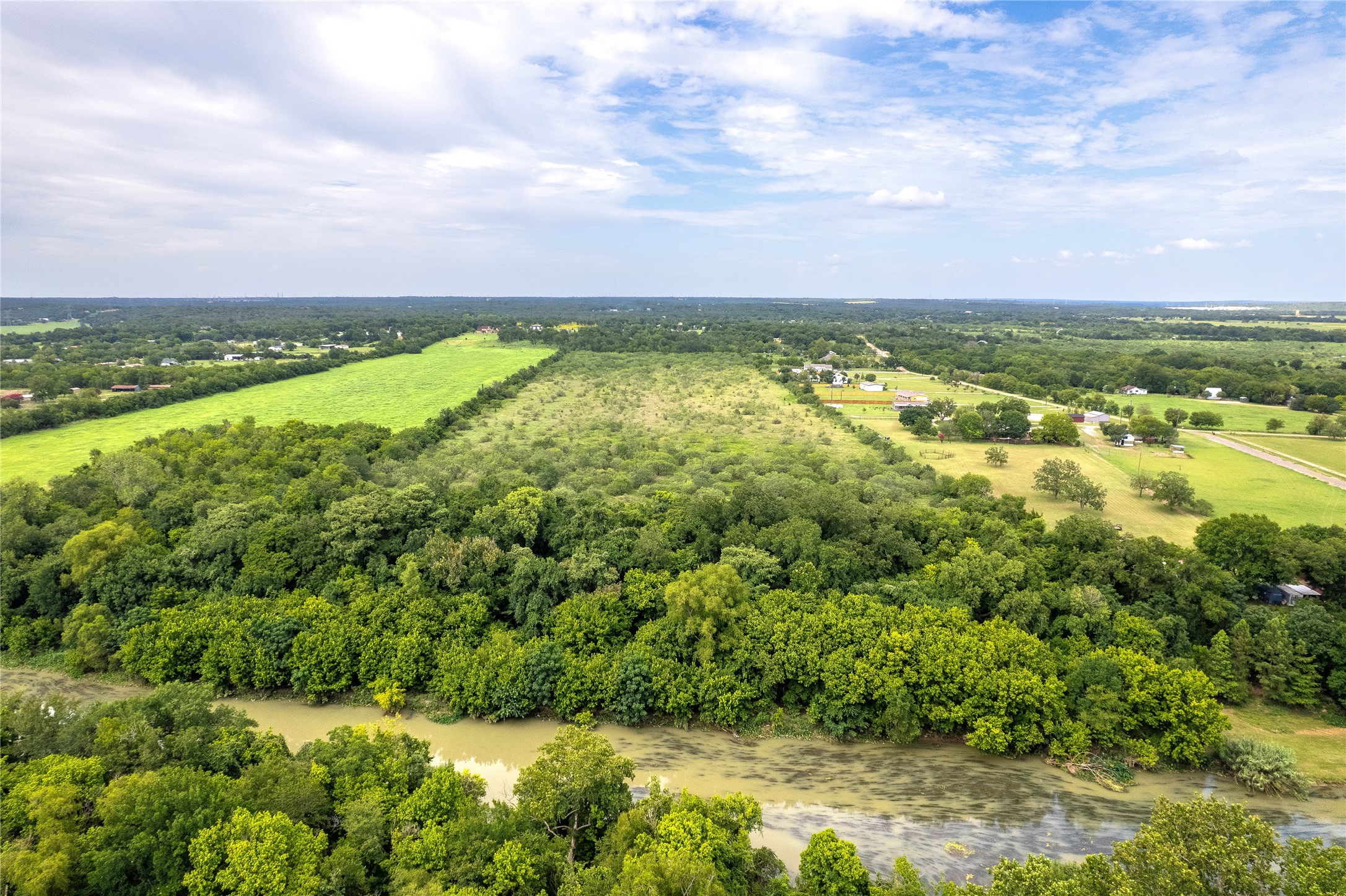 969 Rd Elgin Tx 78602 Road Elgin, TX 78621 - Photo 16 of 17 a view of a city with lots of trees