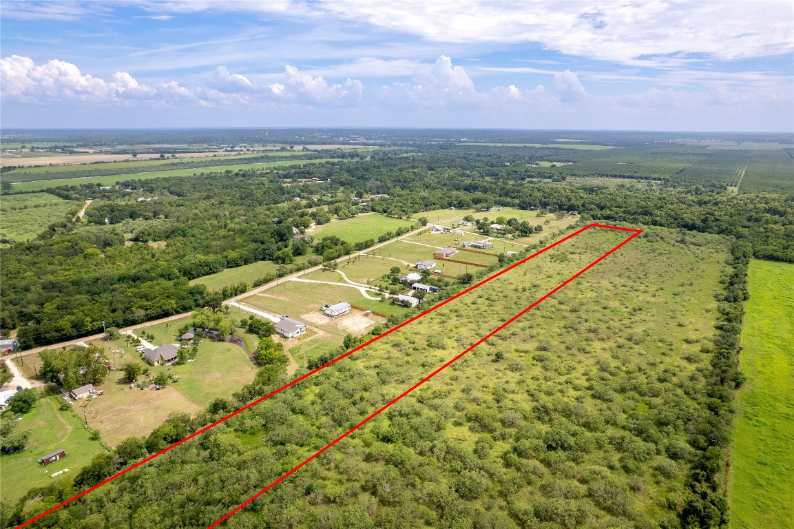 969 Rd Elgin Tx 78602 Road Elgin, TX 78621 - Photo 5 of 17 an aerial view of residential houses with outdoor space and garden