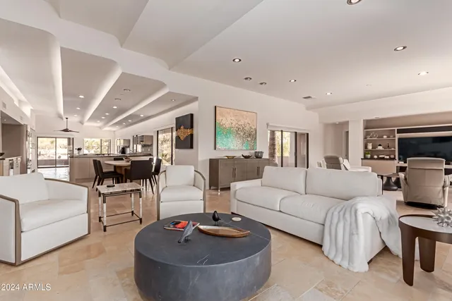 a kitchen with stainless steel appliances granite countertop a sink and a stove