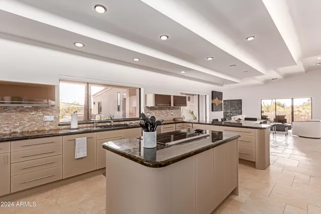 a view of a dining room with furniture large windows and wooden floor