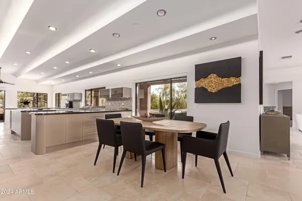 a spacious bedroom with a bed and a couch