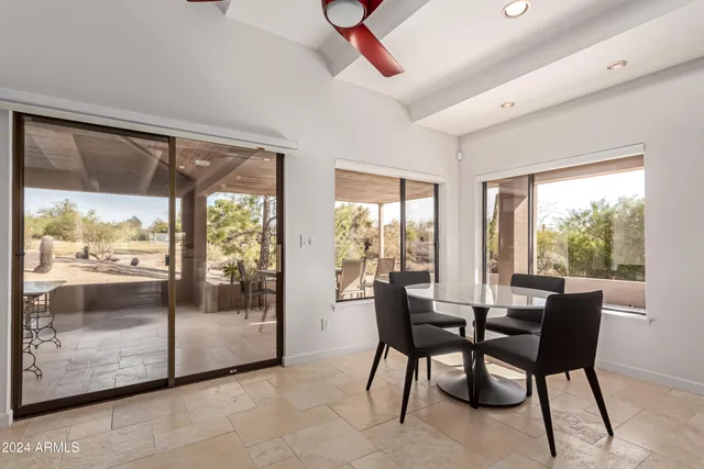 a bathroom with a bathtub sink and mirror