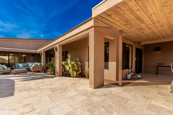 a view of a house with a yard covered in snow