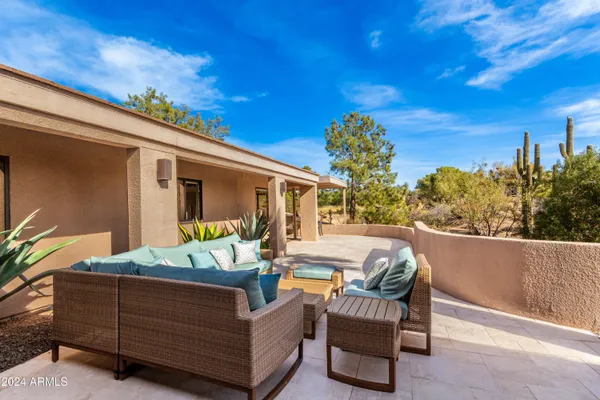 a view of a swimming pool with a lounge chair