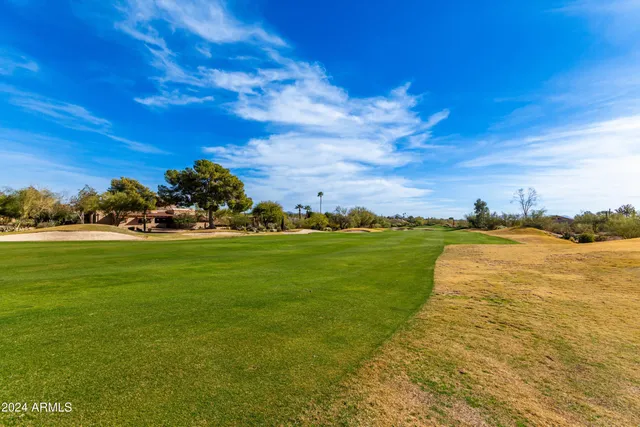 a view of a swimming pool with an outdoor seating