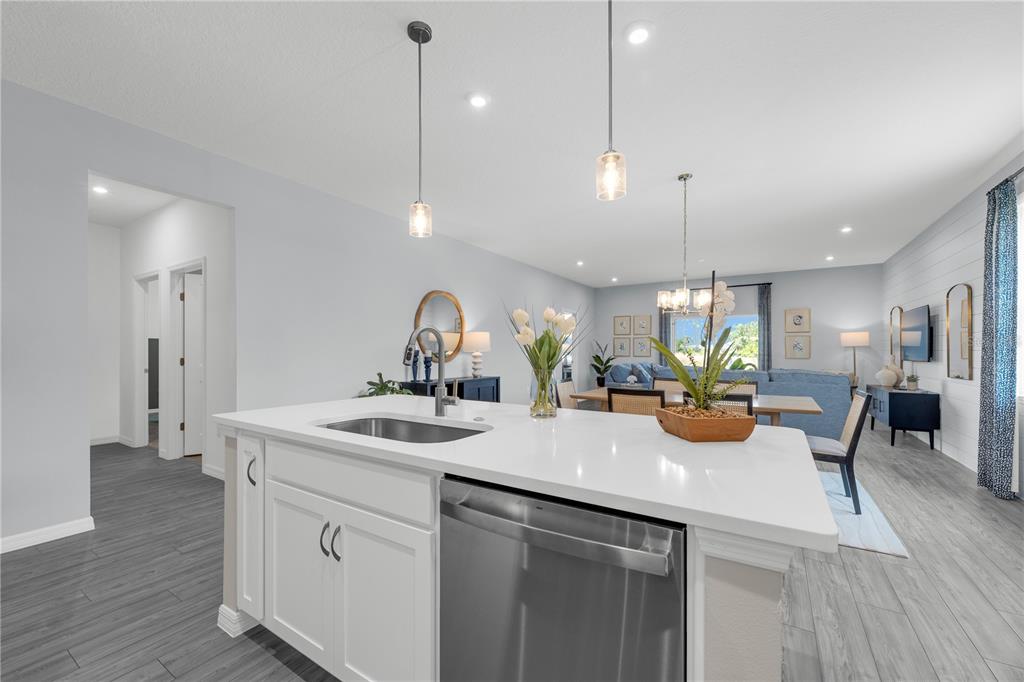933 Pearlwood Loop Bartow, FL 33830 - Photo 11 of 39 a kitchen with a sink a counter space and wooden floor
