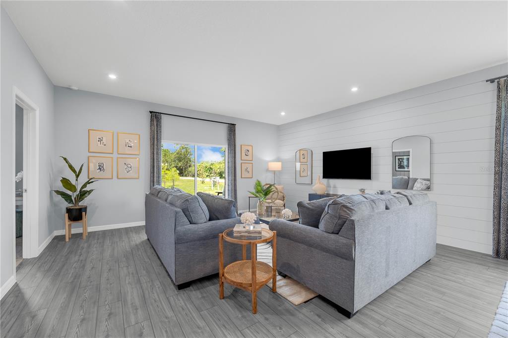 933 Pearlwood Loop Bartow, FL 33830 - Photo 15 of 39 a living room with furniture and a flat screen tv