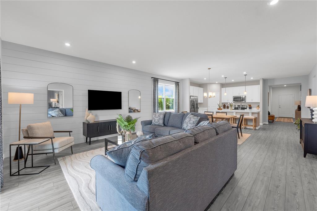 933 Pearlwood Loop Bartow, FL 33830 - Photo 17 of 39 a living room with furniture and a flat screen tv