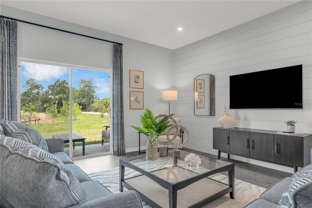 933 Pearlwood Loop Bartow, FL 33830 - Photo 19 of 39 a living room with furniture and a flat screen tv