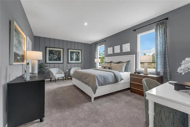 a bedroom with a bed and a table in it