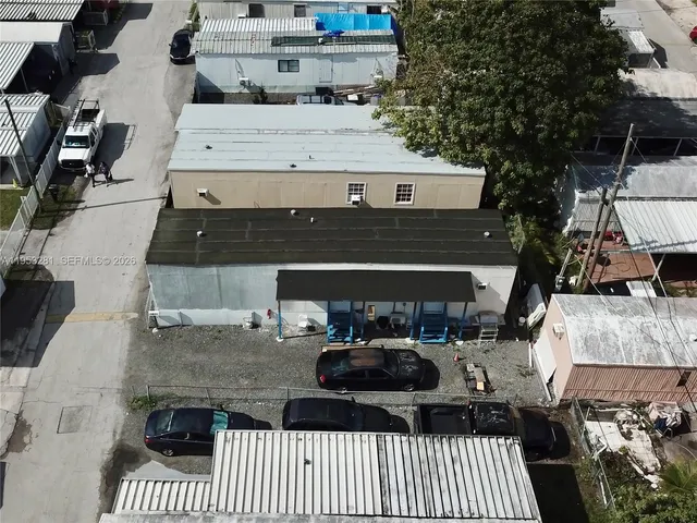 an aerial view of a multi story parking building