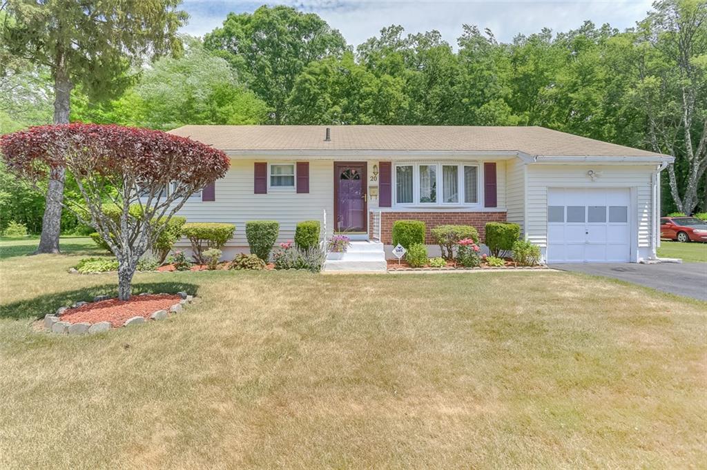 front view of a house with a yard