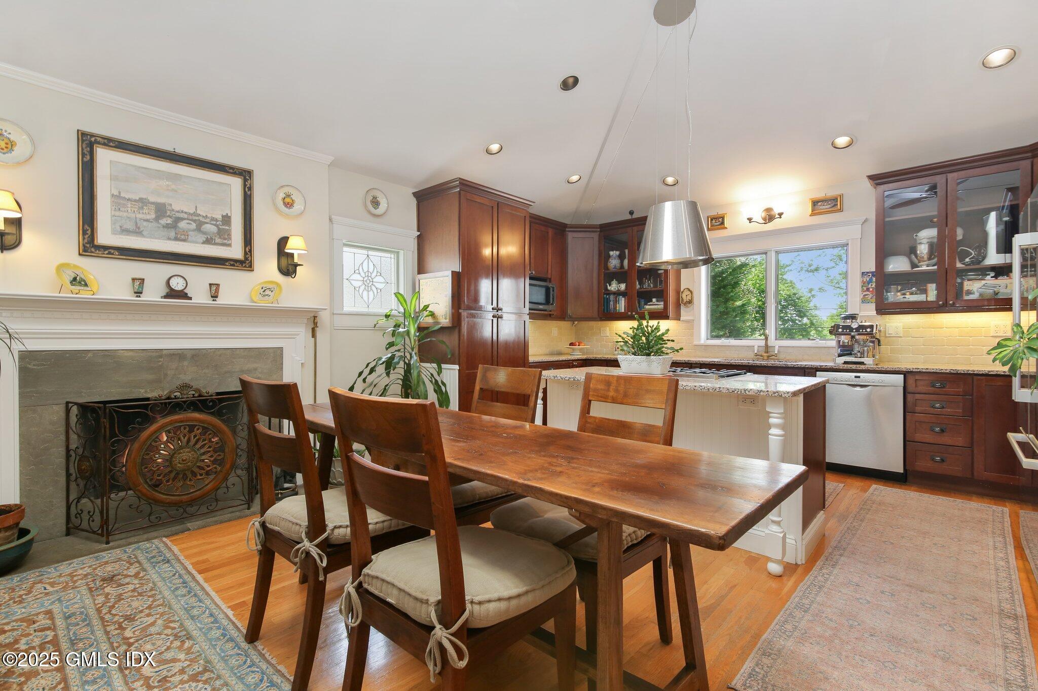 23 Westview Place Riverside, CT 06878 - Photo 13 of 42 a kitchen with a table chairs refrigerator and cabinets