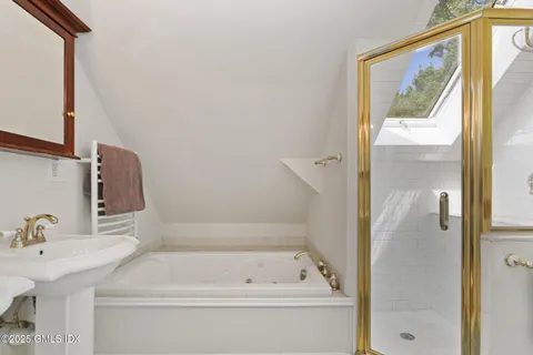 a bathroom with a bathtub and a sink