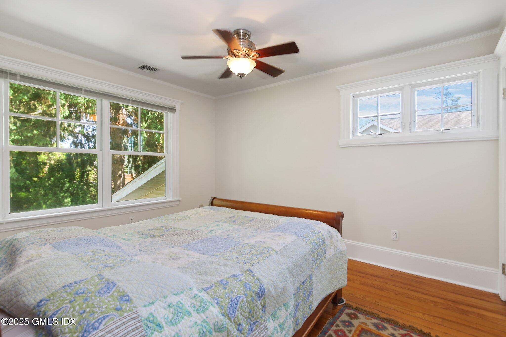23 Westview Place Riverside, CT 06878 - Photo 25 of 42 a bedroom with a bed and a large window