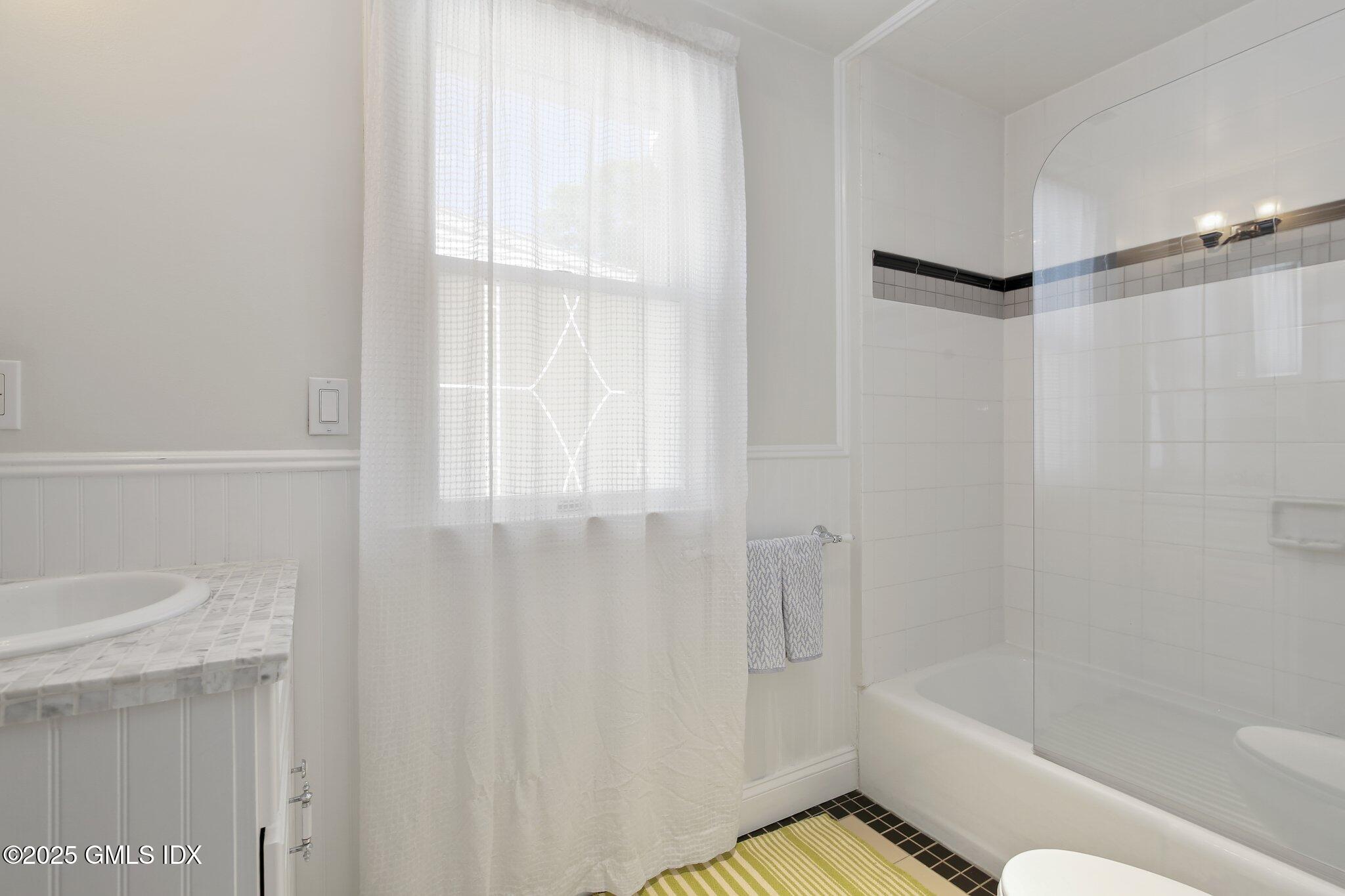 23 Westview Place Riverside, CT 06878 - Photo 26 of 42 a bathroom with a bathtub and a shower