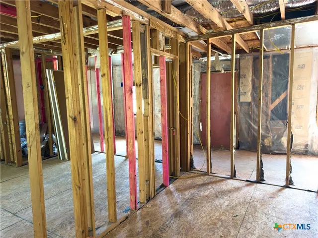 a view of a house with wooden deck