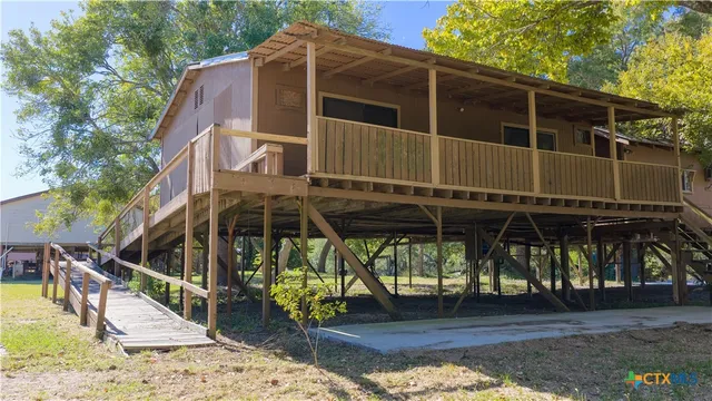a kitchen with a table chairs and a refrigerator
