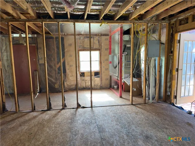 a view of walk in closet with clothes