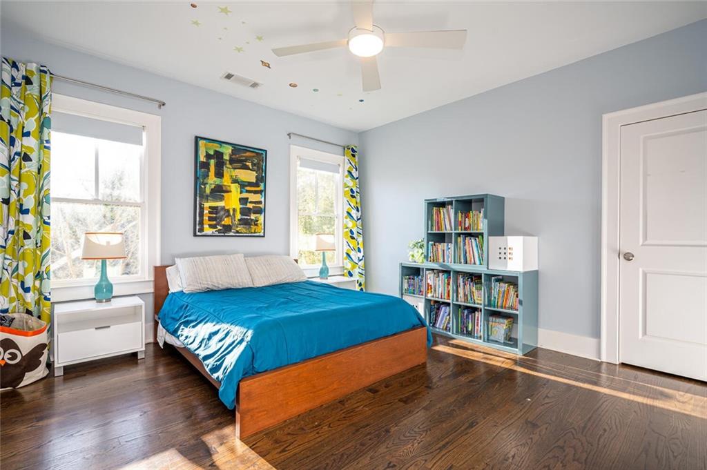 123 Ansley Street Decatur, GA 30030 - Photo 39 of 61 a bedroom with a bed furniture and a book shelf