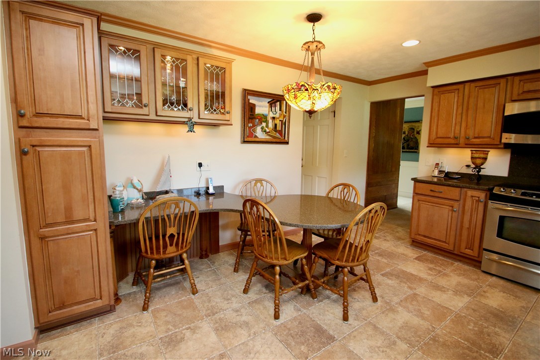 177 Fairfield Road Painesville, OH 44077 - Photo 10 of 16 Glass doors above the table for extra storage and display