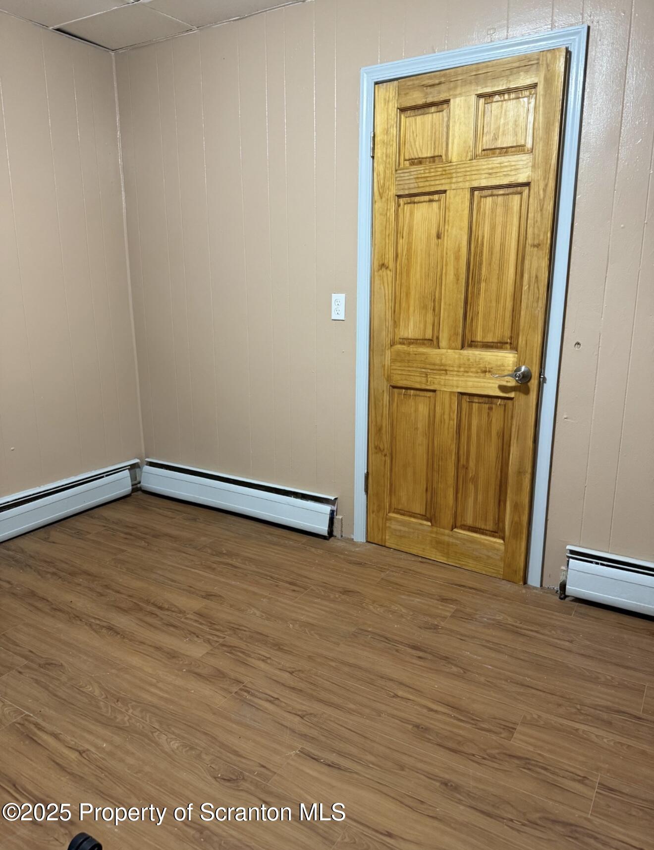 134 Market Street Moscow, PA 18444 - Photo 6 of 11 a view of an empty room with wooden floor