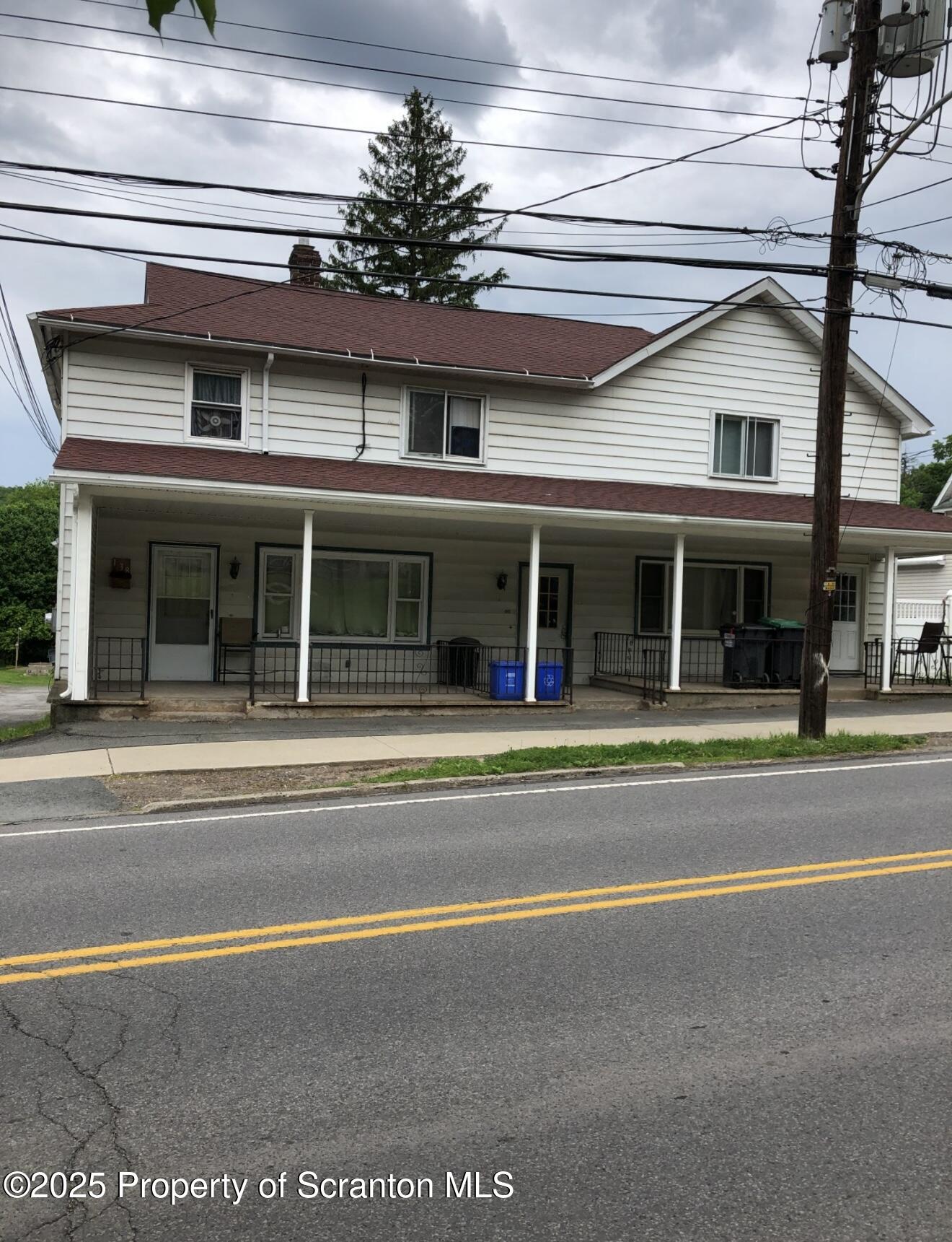 134 Market Street Moscow, PA 18444 - Photo 8 of 11 a view of a large building with a large windows