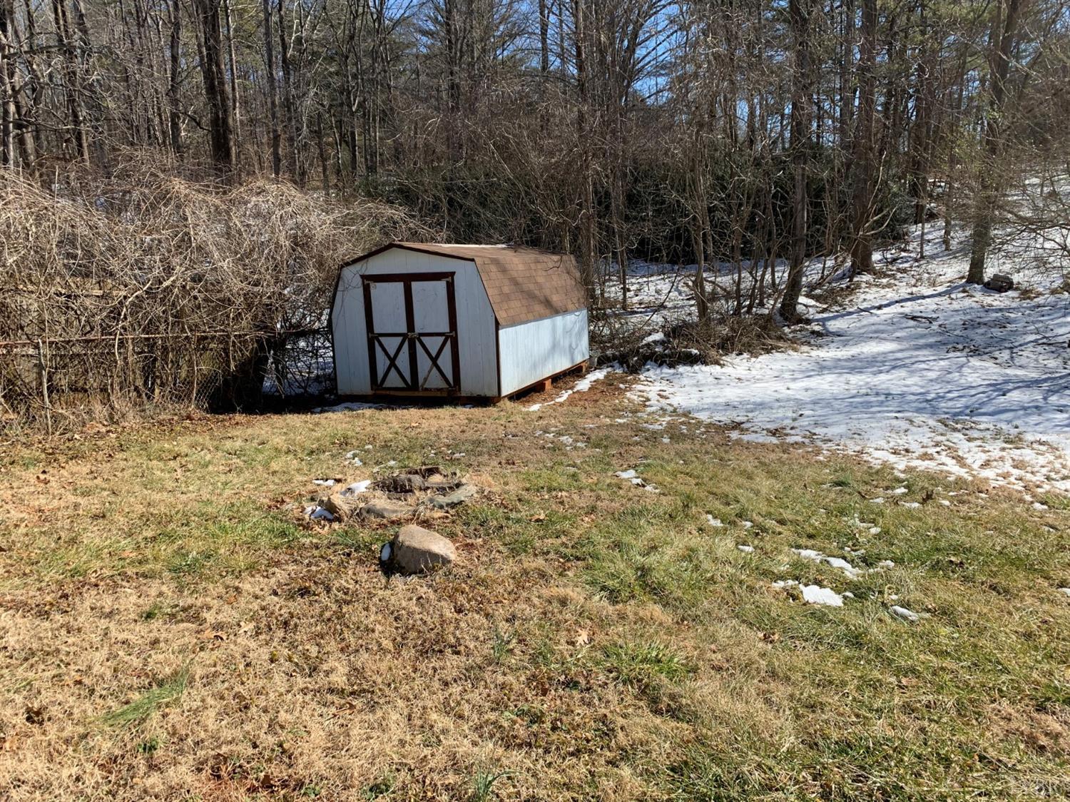 343 Thomas Road Madison Heights, VA 24572 - Photo 8 of 8 a view of a yard covered in snow