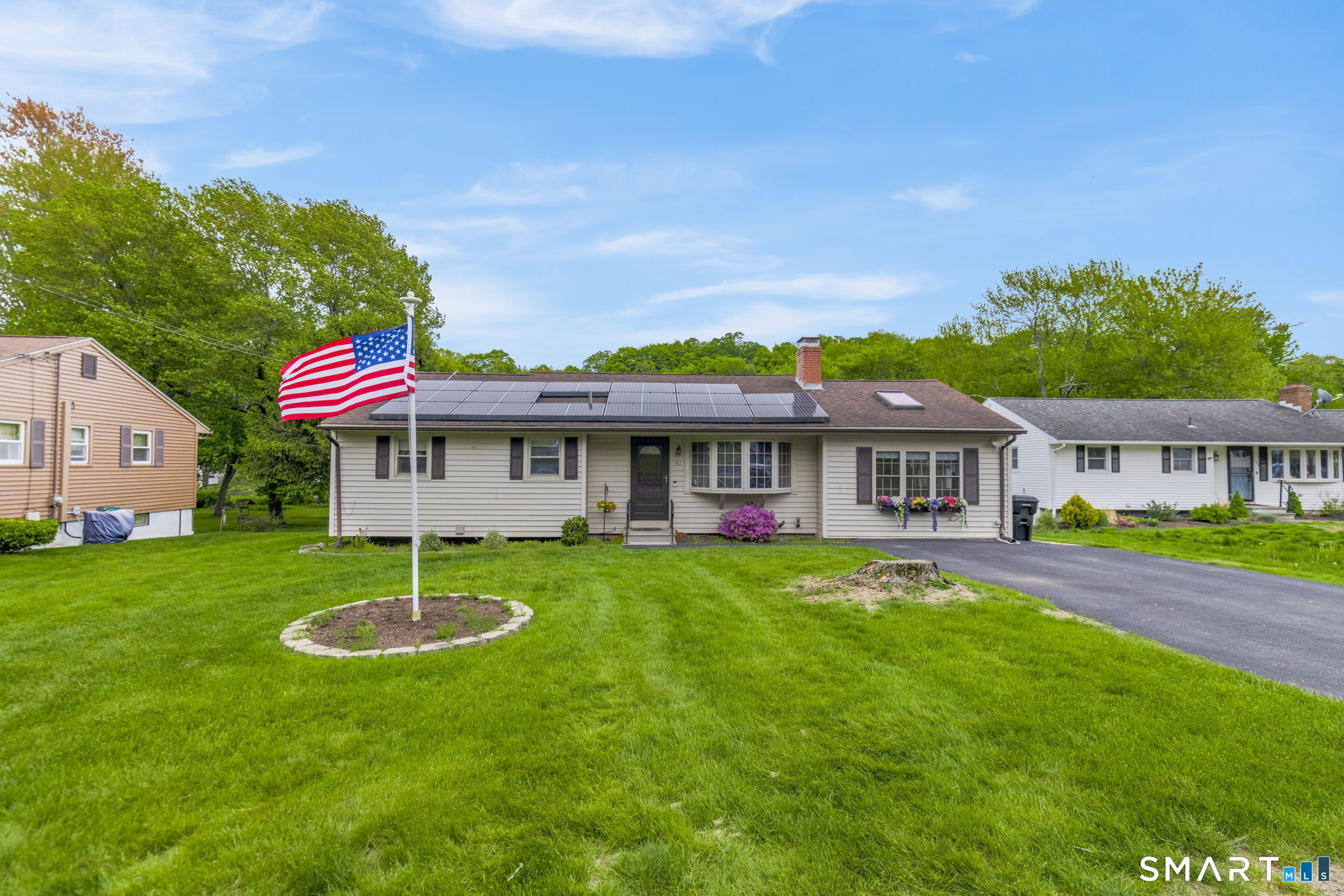 102 Wayne Lane Meriden, CT 06450 - Photo 1 of 36 a front view of a house with a garden