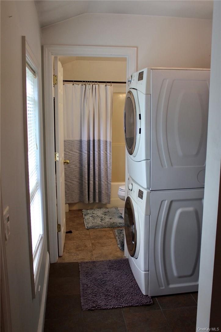 5834 Albany Post Road Cortlandt Manor, NY 10567 - Photo 7 of 14 Laundry area with side by side washer and dryer. Stackable units replaced in 2021