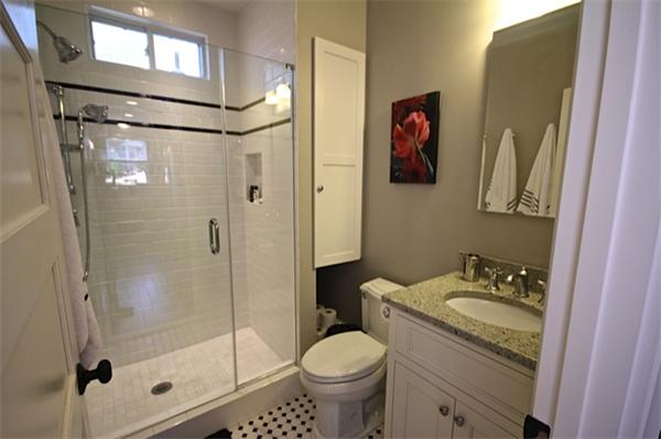 48 Banks Road Swampscott, MA 01907 - Photo 12 of 28 a bathroom with a granite countertop toilet sink and shower