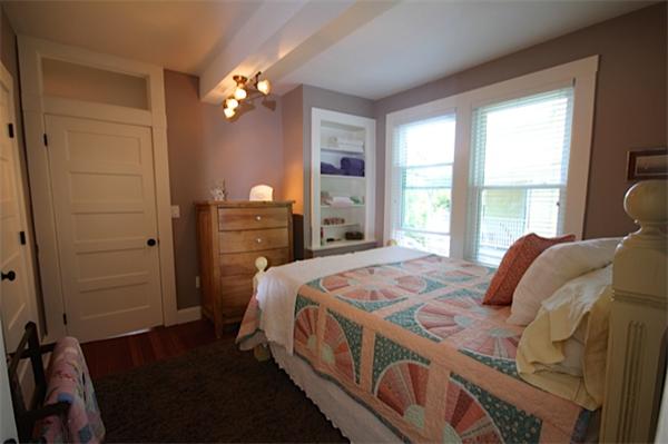 48 Banks Road Swampscott, MA 01907 - Photo 13 of 28 a bedroom with a bed a dresser and a large window