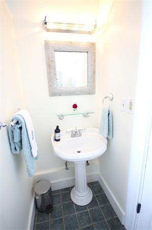 48 Banks Road Swampscott, MA 01907 - Photo 21 of 28 a bathroom with a sink toilet and mirror