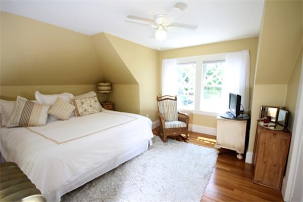 48 Banks Road Swampscott, MA 01907 - Photo 24 of 28 a bedroom with a bed couch and a window